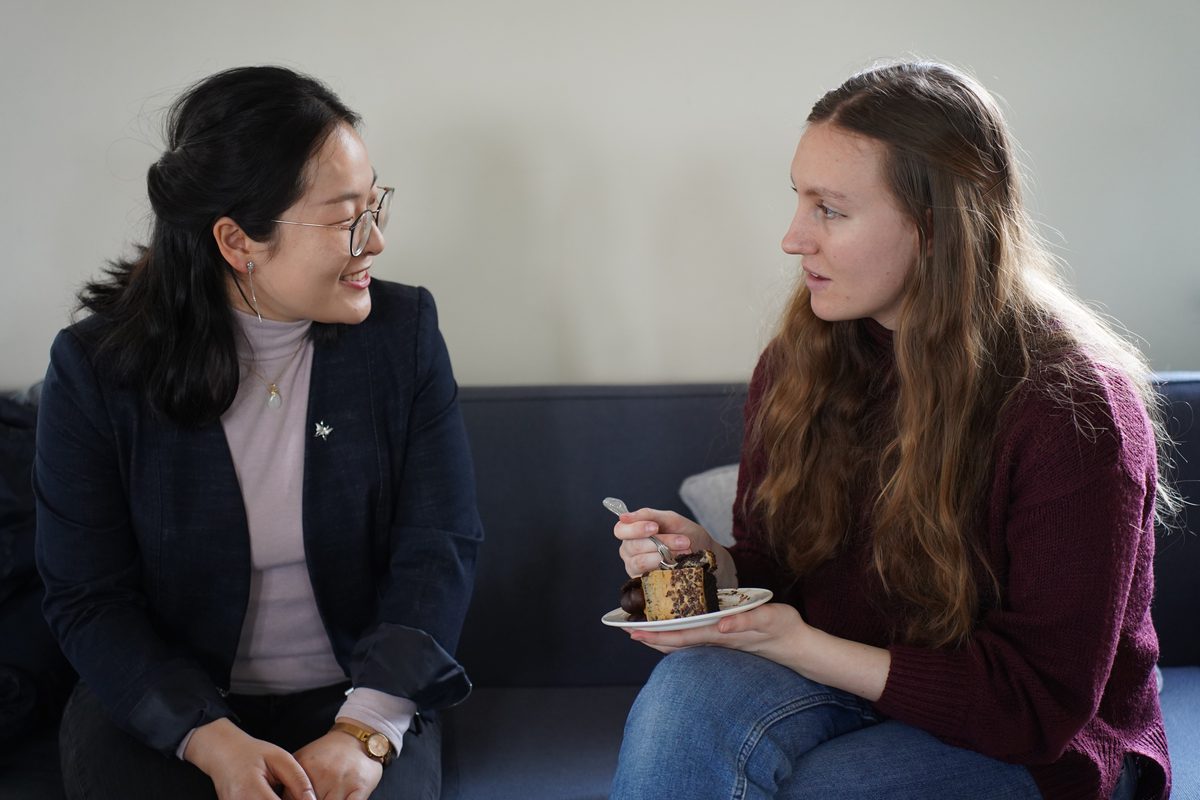 Two students talking over coffee